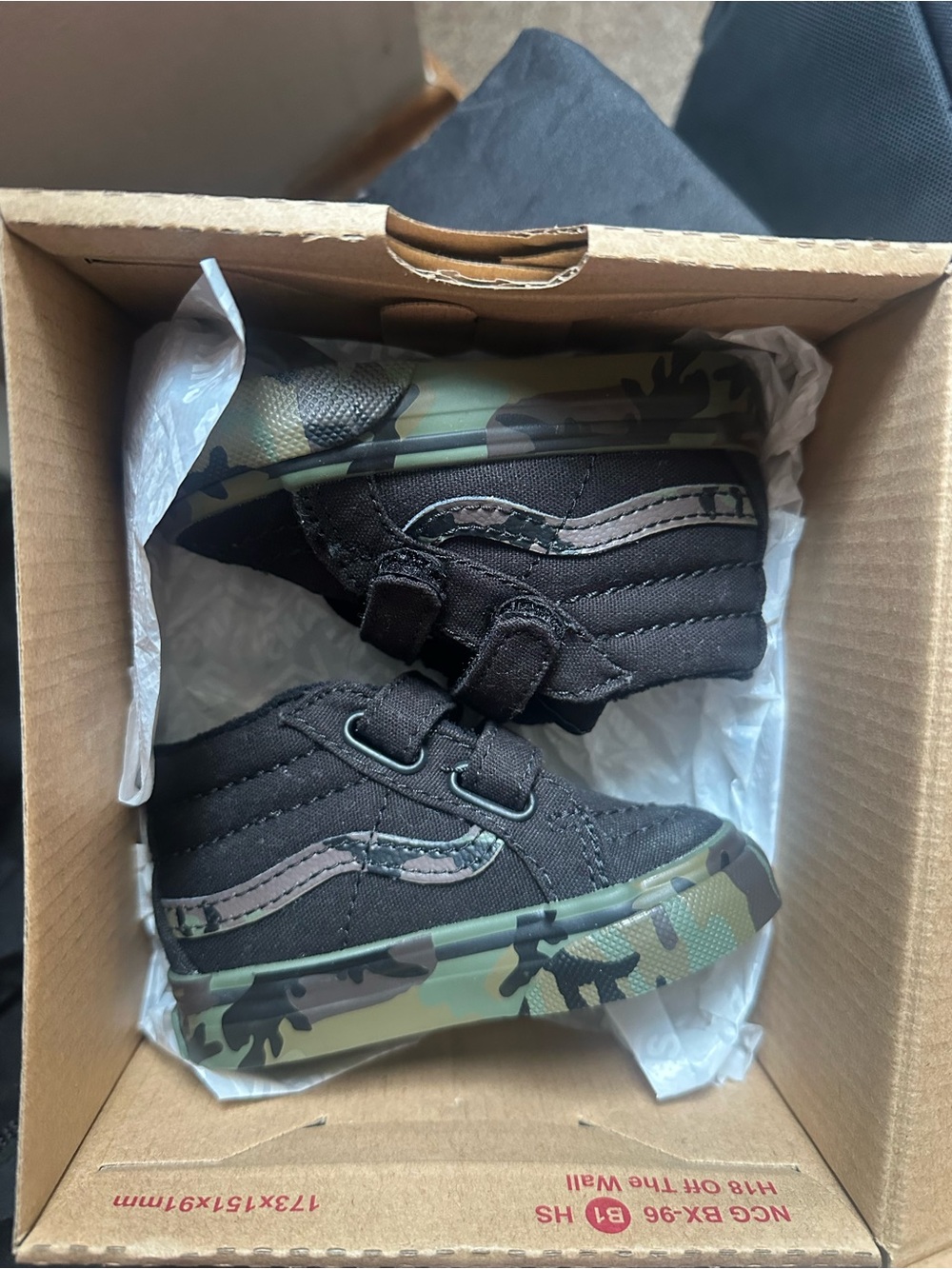 Vans Kids Black High-Top Sneakers with Green Camo Sole